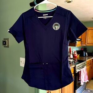 Navy blue scrub top with pockets
